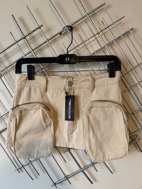 PrettyLittleThing Beige Mini Skirt with Dual Zip Pockets